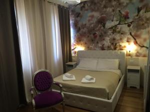 Postel nebo postele na pokoji v ubytování Rigoletto Rental Rooms