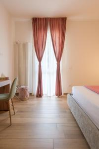 Letto o letti in una camera di Sant'Orsola Lodge Bologna