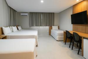 TV a/nebo společenská místnost v ubytování Hotel Solar Paulista