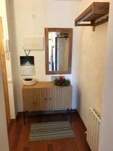 a mirror on top of a dresser in a room at Benasque Valley Apartment in Bisaurri