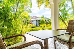 A garden outside Travellers Beach Resort