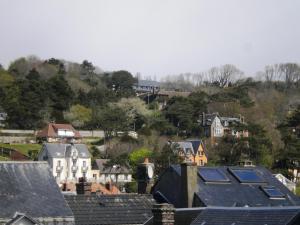 a group of houses with solar panels on their roofs at Chambre D'hôte Villa Maurice in Étretat