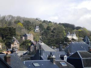 a view of roofs of houses in a town at Chambre D'hôte Villa Maurice in Étretat