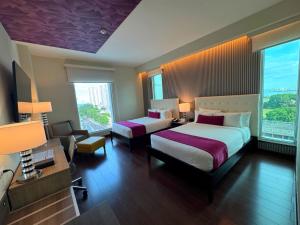Ein Bett oder Betten in einem Zimmer der Unterkunft Ramada Plaza by Wyndham Panama Punta Pacifica