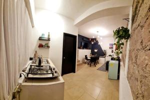 a kitchen with a stove and a table in a room at Tiny House in Guanajuato