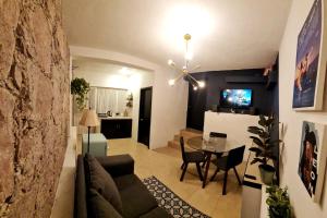 a living room with a couch and a table at Tiny House in Guanajuato