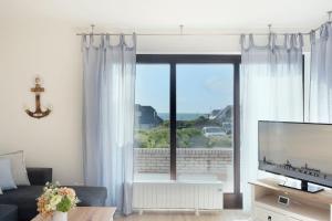 TV a/nebo společenská místnost v ubytování Haus Humml + 36 fotografií