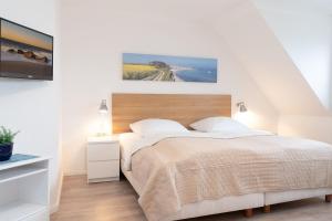 Postel nebo postele na pokoji v ubytování Haus Hasenkamp 26 Hasenbau