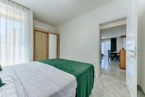 Postel nebo postele na pokoji v ubytování ARA Lux Apartments