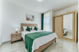 Postel nebo postele na pokoji v ubytování ARA Lux Apartments