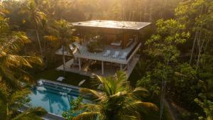 an aerial view of a house in the jungle with a swimming pool at Sola - Boutique Hotel in Ahangama