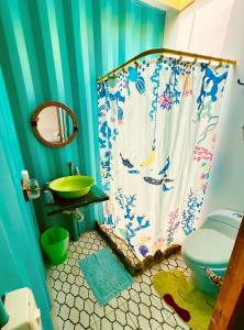 a bathroom with a shower and a sink and a toilet at Casa campestre Namaste Entre La Mesa y Anapoima con piscina privada in La Mesa +30 photos