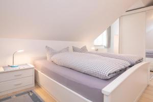 Giường trong phòng chung tại Familyhaus- Wohnung 8