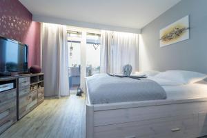 Giường trong phòng chung tại Berolina Jule