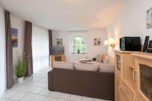 TV a/nebo společenská místnost v ubytování Haus Pegasus Gartenliebe + 23 fotografií