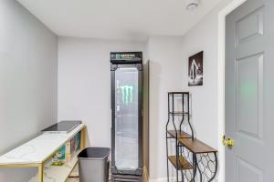 an empty refrigerator in a room with a shelf at Newly Renovated Abode with Patio in Baltimore! in Baltimore