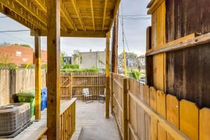 a house under construction with a wooden fence at Newly Renovated Abode with Patio in Baltimore! in Baltimore