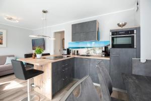 a kitchen with a wooden counter top in a room at Lucia in Scharbeutz