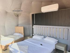Postel nebo postele na pokoji v ubytování WADl RUM DESERT CAMP