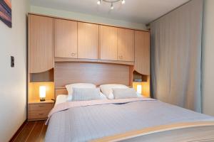 Ένα ή περισσότερα κρεβάτια σε δωμάτιο στο Meerblick mit Wohlfühlfaktor