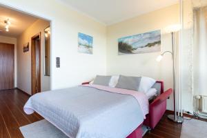 Ένα ή περισσότερα κρεβάτια σε δωμάτιο στο Meerblick mit Wohlfühlfaktor