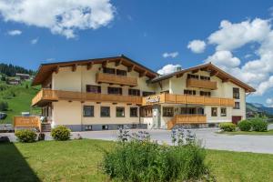 a large building with balconies on the side of it at Fernsicht Alpen-Apartments in Lech am Arlberg