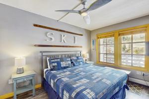 a bedroom with a bed and a ceiling fan at Passage Point 422 in Copper Mountain +61 photos