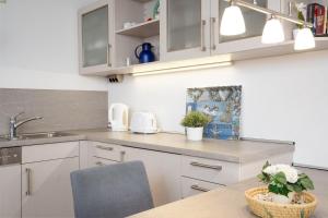 Kuchyň nebo kuchyňský kout v ubytování Strandresidenz Wohnung 1