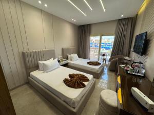 Voodi või voodid majutusasutuse Ramage Hotel & Resort toas
