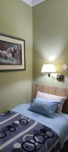 Cama o camas de una habitación en Hospedaje CASA REAL