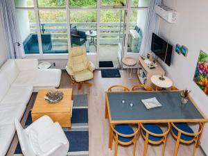 Et tv og/eller underholdning på Cozy Retreat in Sondervig - By Traum Ferienwohnungen