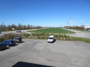 a parking lot with a white car parked in it at Fenix Inn in Lund