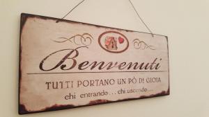 a sign for a restaurant hanging on a wall at Appartamento Perugia Centro in Perugia