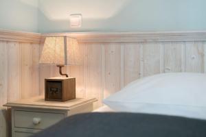 Ένα ή περισσότερα κρεβάτια σε δωμάτιο στο Strandresidenz Vogelflug Sundperle