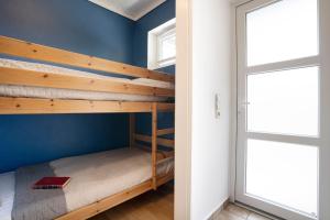 Postel nebo postele na pokoji v ubytování Blankwasserweg 131 Lensterstrand Oase Bungalow 4