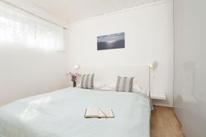 Postel nebo postele na pokoji v ubytování Blankwasserweg 131 Lensterstrand Oase Bungalow 4