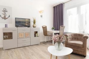 TV a/nebo společenská místnost v ubytování Skippers Hus Ankerbucht