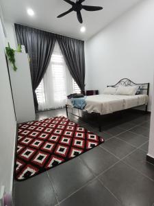 Postel nebo postele na pokoji v ubytování Homestay faleeq