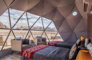 Postel nebo postele na pokoji v ubytování WADl RUM DESERT CAMP