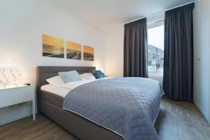 Postel nebo postele na pokoji v ubytování KellenHus Wohnung 3