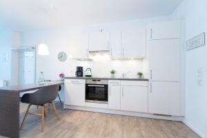 Kuchyň nebo kuchyňský kout v ubytování KellenHus Wohnung 3