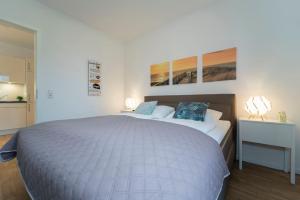 Postel nebo postele na pokoji v ubytování KellenHus Wohnung 3