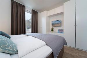 Postel nebo postele na pokoji v ubytování KellenHus Wohnung 3