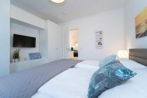 Postel nebo postele na pokoji v ubytování KellenHus Wohnung 3