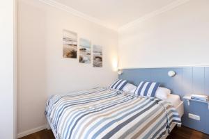 Postel nebo postele na pokoji v ubytování Grömitz Center Wohnung 763