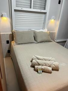 Ένα ή περισσότερα κρεβάτια σε δωμάτιο στο Desperte com vista para o mar - luxo e conforto no melhor bairro de Santos +44 φωτογραφίες