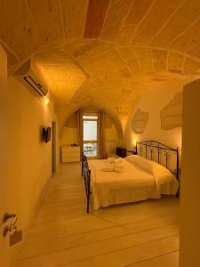 a bedroom with a bed in a room at Dimora 69 in Lecce