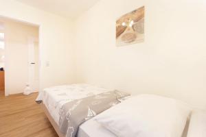 Postel nebo postele na pokoji v ubytování Lindenbuschen 2 Wohnung 5