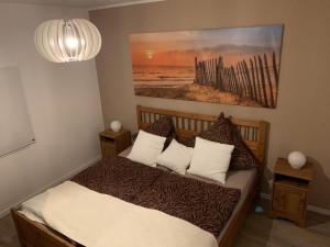 Ένα ή περισσότερα κρεβάτια σε δωμάτιο στο Strandloft No 5