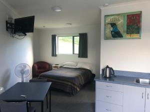 Postel nebo postele na pokoji v ubytování Linkwater Apartments - Studio Unit + 1 fotografie